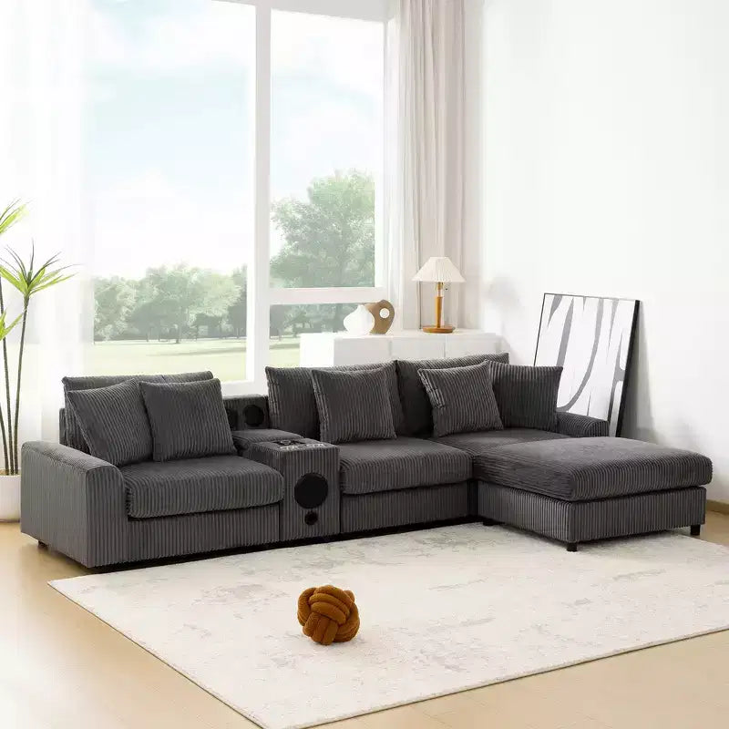 Divano componibile a L a 4 posti Whisen, comoda chaise longue convertibile, console, altoparlanti Bluetooth, porte USB, portabicchieri
