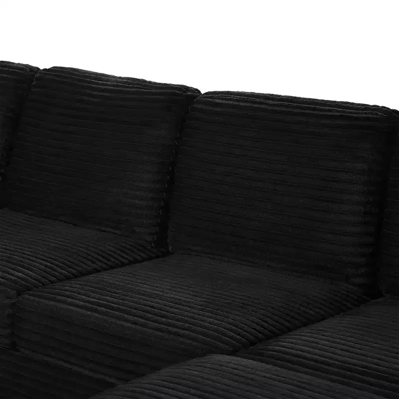 Divano sezionale Whisen in velluto a coste con pouf mobile e tasche laterali portaoggetti