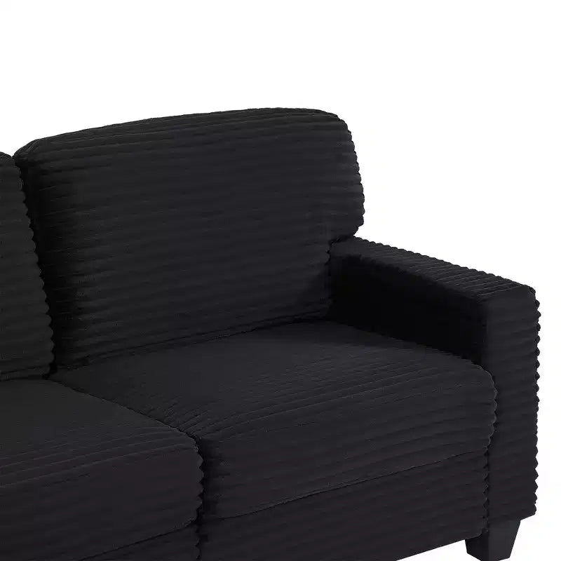 Divano sezionale Whisen in velluto a coste con pouf mobile e tasche laterali portaoggetti