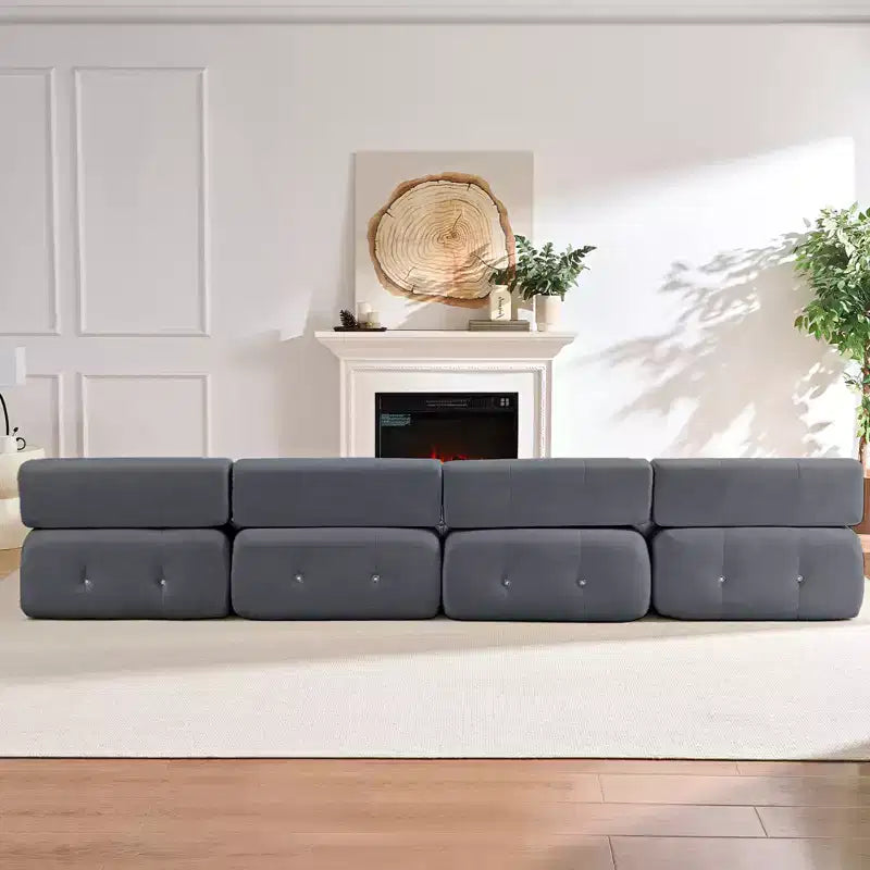 Divano sezionale in velluto a forma di L Mjkone, divano componibile a 4 posti con pouf, divani trasformabili con bordo borchiato
