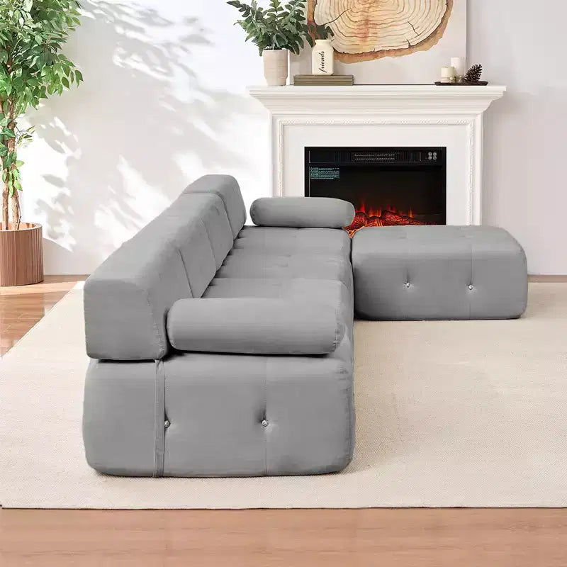 Divano sezionale in velluto a forma di L Mjkone, divano componibile a 4 posti con pouf, divani trasformabili con bordo borchiato