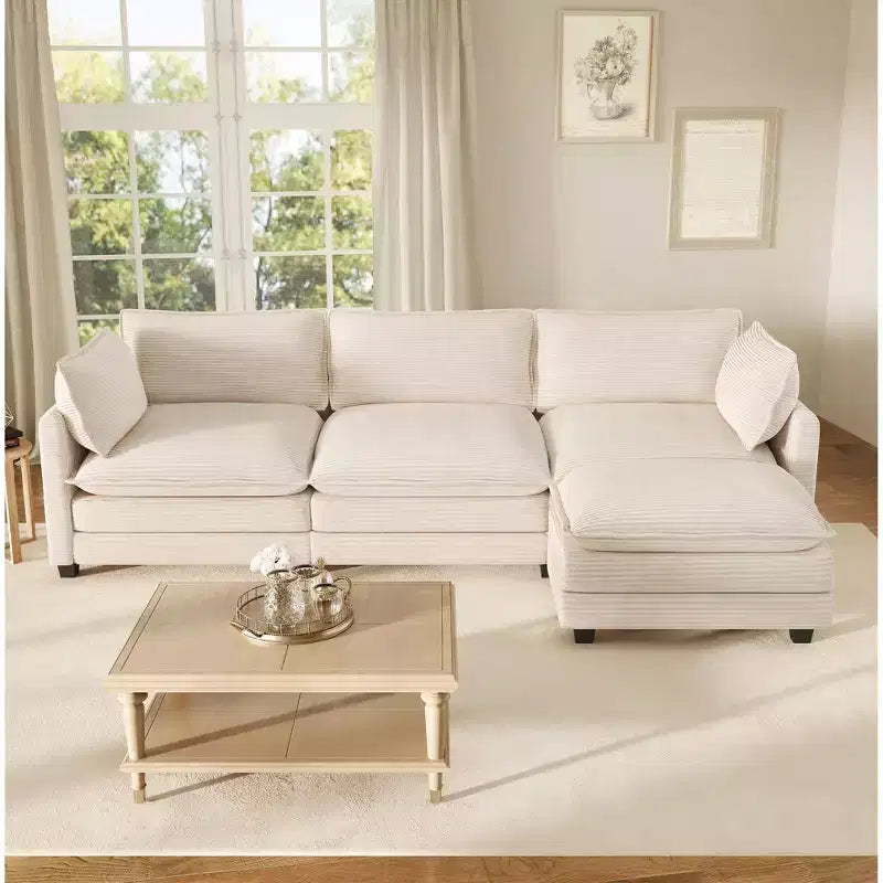 Divano componibile a L Hyleory Cozy Corduroy con poggiapiedi mobile - Tocco Morbido, Design Salvaspazio